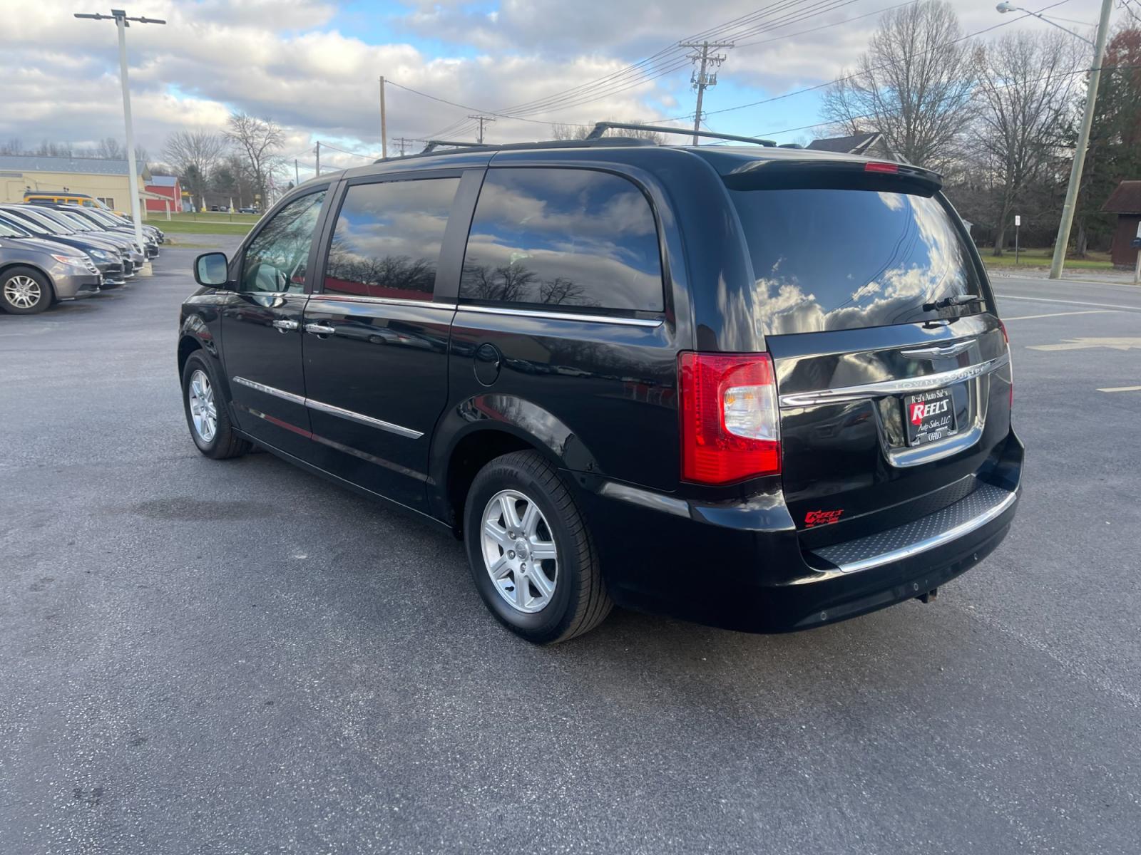 2012 Black /Black Chrysler Town & Country (2C4RC1BG0CR) with an 3.6L V6 DOHC 24V FFV engine, 6-Speed Automatic transmission, located at 11115 Chardon Rd. , Chardon, OH, 44024, (440) 214-9705, 41.580246, -81.241943 - This 2012 Chrysler Town & Country Touring - L model features a luxurious interior with cloth seats that are heated for comfort, complemented by a heated steering wheel for added warmth in cooler weather. It comes equipped with a convenient tow package, enhancing its utility for pulling trailers or b - Photo #9